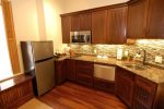 Kitchenette has a microwave, oven, range and sink, granite countertops 